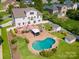 Expansive backyard featuring a pool, deck, gazebo, outdoor grill, and lush landscaping at 12004 New Bond Dr, Huntersville, NC 28078