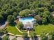 Aerial view of the community pool and amenities area, nestled among lush trees at 12004 New Bond Dr, Huntersville, NC 28078