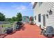 Spacious back deck featuring an outdoor dining area, grilling area, and a relaxing lounge chair at 12004 New Bond Dr, Huntersville, NC 28078