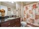 Bathroom featuring granite countertop, vanity, and patterned shower curtain at 12004 New Bond Dr, Huntersville, NC 28078