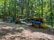 Canoe storage racks are neatly organized in a wooded area at 12004 New Bond Dr, Huntersville, NC 28078
