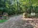 Welcoming entrance with stacked stone pillars and community signage at 12004 New Bond Dr, Huntersville, NC 28078