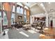 Bright living room with soaring windows, a fireplace, and elegant furnishings at 12004 New Bond Dr, Huntersville, NC 28078