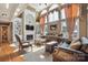 Cozy living room featuring built-in shelving and a fireplace at 12004 New Bond Dr, Huntersville, NC 28078