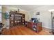 Office space with hardwood floors, built in shelves, and executive desk at 12004 New Bond Dr, Huntersville, NC 28078