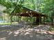 Community pavilion with stone fireplace and picnic tables at 12004 New Bond Dr, Huntersville, NC 28078