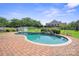 Beautiful in-ground pool with brick surround, landscaped accents and storage building at 12004 New Bond Dr, Huntersville, NC 28078