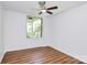 Large bedroom with a modern ceiling fan and a window overlooking the yard at 1300 Queens Rd # 405, Charlotte, NC 28207