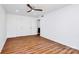 Spacious bedroom featuring a ceiling fan, closet and ensuite bath at 1300 Queens Rd # 405, Charlotte, NC 28207