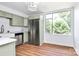 Bright kitchen with stainless steel appliances and a large window overlooking the yard at 1300 Queens Rd # 405, Charlotte, NC 28207