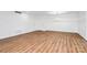Spacious living room with hardwood floors, contemporary light fixture, and neutral paint at 1300 Queens Rd # 405, Charlotte, NC 28207