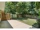 This backyard features a lush lawn, mature trees, and a privacy fence, perfect for outdoor entertaining at 14658 Laura Michelle Rd, Huntersville, NC 28078