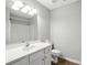 Well-lit bathroom features modern fixtures, a shower-tub combo, and a spacious vanity with plenty of storage at 14658 Laura Michelle Rd, Huntersville, NC 28078