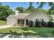 Charming single-story home with well-maintained lawn, trimmed bushes, and black shutters at 14658 Laura Michelle Rd, Huntersville, NC 28078