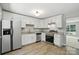 Modern kitchen featuring granite countertops, stainless steel appliances, and white cabinets at 14658 Laura Michelle Rd, Huntersville, NC 28078