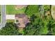An aerial view of the house showing the roof, surrounding trees and backyard at 14747 Pomerol Ln, Pineville, NC 28134