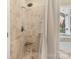 Tile shower with seat, handheld showerhead and a window at 14747 Pomerol Ln, Pineville, NC 28134