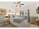 Bedroom with modern ceiling fan, wainscoting, and natural light at 14747 Pomerol Ln, Pineville, NC 28134