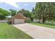 Well-kept brick home with a two-car garage, a lush lawn, and mature trees in a suburban neighborhood at 14747 Pomerol Ln, Pineville, NC 28134