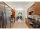 Bright, open kitchen with eat-in nook features stainless appliances and warm cabinetry at 14747 Pomerol Ln, Pineville, NC 28134