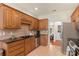 Traditional kitchen with wooden cabinets, stainless steel appliances, and tile backsplash at 14747 Pomerol Ln, Pineville, NC 28134