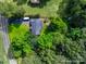 Aerial view of property showcasing the house, driveway, fire pit, and expansive, tree-filled backyard at 1498 Legion Rd, Fort Mill, SC 29715