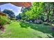 Expansive backyard with lush greenery, featuring a gazebo, storage shed, and manicured lawn at 1498 Legion Rd, Fort Mill, SC 29715