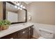 Well-maintained bathroom with a large mirror, white wainscoting, and modern fixtures at 1498 Legion Rd, Fort Mill, SC 29715
