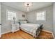 Charming bedroom with hardwood floors, shiplap walls, and a modern chandelier at 1498 Legion Rd, Fort Mill, SC 29715