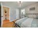 Comfortable bedroom featuring shiplap walls, hardwood floors, and ample natural light at 1498 Legion Rd, Fort Mill, SC 29715