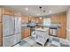 The kitchen features stainless steel appliances, hardwood cabinets, and an island at 1498 Legion Rd, Fort Mill, SC 29715