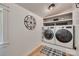 Clean and organized laundry room with modern washer and dryer, shiplap walls and shelving at 1498 Legion Rd, Fort Mill, SC 29715
