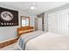 Cozy bedroom with hardwood floors, a dresser with mirror and a large closet at 1605 Ambergate Dr, Waxhaw, NC 28173