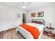 Bright bedroom features hardwood floors, a ceiling fan, colorful rug, and unique decor at 1605 Ambergate Dr, Waxhaw, NC 28173