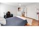 Bedroom with wooden floors and a ceiling fan, including a dedicated desk area at 1605 Ambergate Dr, Waxhaw, NC 28173