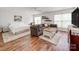 Open living and sleeping area with hardwood floors, neutral paint, and lots of natural light at 1605 Ambergate Dr, Waxhaw, NC 28173