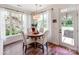 Bright breakfast nook with hardwood floors and lots of windows with natural light at 1605 Ambergate Dr, Waxhaw, NC 28173