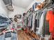 Walk-in closet with extensive shelving, hanging racks, and an organized system for clothes and shoes at 1605 Ambergate Dr, Waxhaw, NC 28173