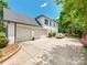 This is a three car garage home with an extra-long driveway for plenty of parking at 1605 Ambergate Dr, Waxhaw, NC 28173