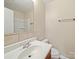 Well-lit bathroom featuring a vanity with a sink and a tile backsplash at 197 Horseshoe Loop, Statesville, NC 28625