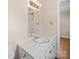 Charming bathroom featuring a vanity with a sink and mirror, ample lighting at 197 Horseshoe Loop, Statesville, NC 28625
