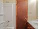Bathroom featuring an over-tub shower and a wooden vanity at 197 Horseshoe Loop, Statesville, NC 28625