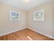 Bedroom featuring two windows and laminate wood-look flooring at 197 Horseshoe Loop, Statesville, NC 28625