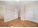 Cozy bedroom featuring hardwood floors, closet, and neutral paint at 197 Horseshoe Loop, Statesville, NC 28625