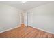 Bedroom featuring laminate flooring and an open closet at 197 Horseshoe Loop, Statesville, NC 28625