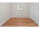 Bedroom showcases wood-look floors, a window, and closet with double doors at 197 Horseshoe Loop, Statesville, NC 28625