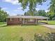Charming brick home featuring a carport and well-maintained lawn at 197 Horseshoe Loop, Statesville, NC 28625