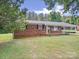 Beautiful brick home with a convenient carport and lush green yard at 197 Horseshoe Loop, Statesville, NC 28625