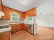 Inviting kitchen with stainless steel appliances, wood cabinets, and a functional island at 197 Horseshoe Loop, Statesville, NC 28625