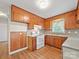 Efficient kitchen with light countertops and wooden cabinets at 197 Horseshoe Loop, Statesville, NC 28625